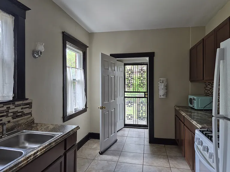 Kitchen with view of the doorway to the back porch.