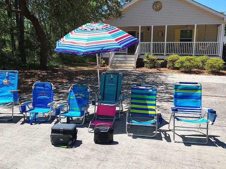 Beach chairs, umbrella, cooler and portable speaker included.