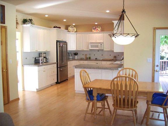 Entertainers kitchen with an eating space that flows to the living room