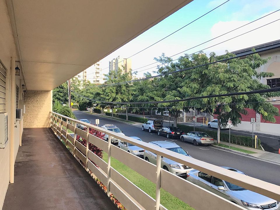 View to the left of walkway in front of door.