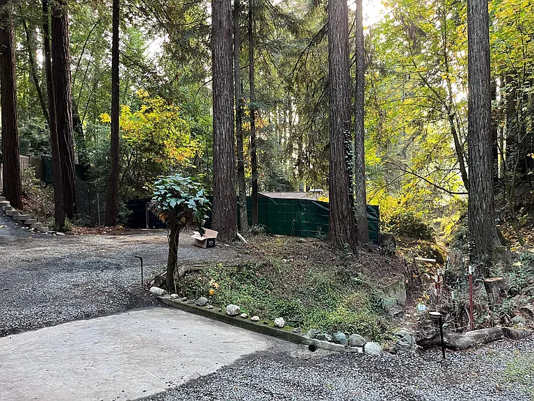 Privacy fence/screen for property below; parking area for no more than 2 vehicles