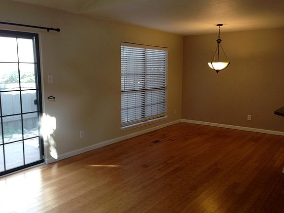 Open concept dining/living room with wood floors