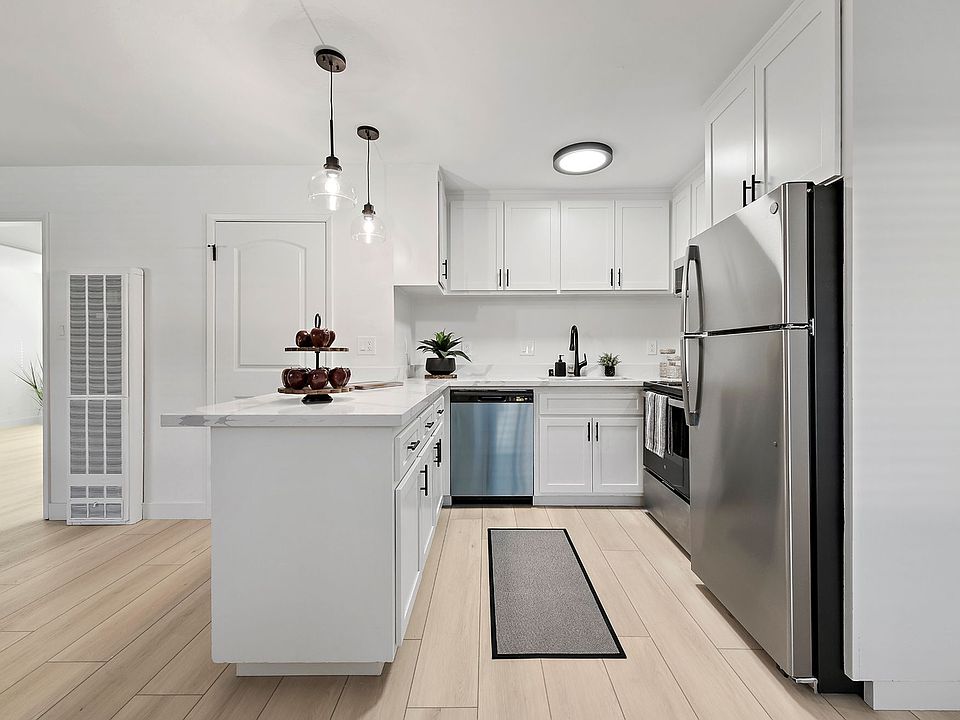 Enjoy modern conveniences with a complete set of stainless-steel appliances, including a dishwasher, microwave, and refrigerator_perfect for easy everyday living.