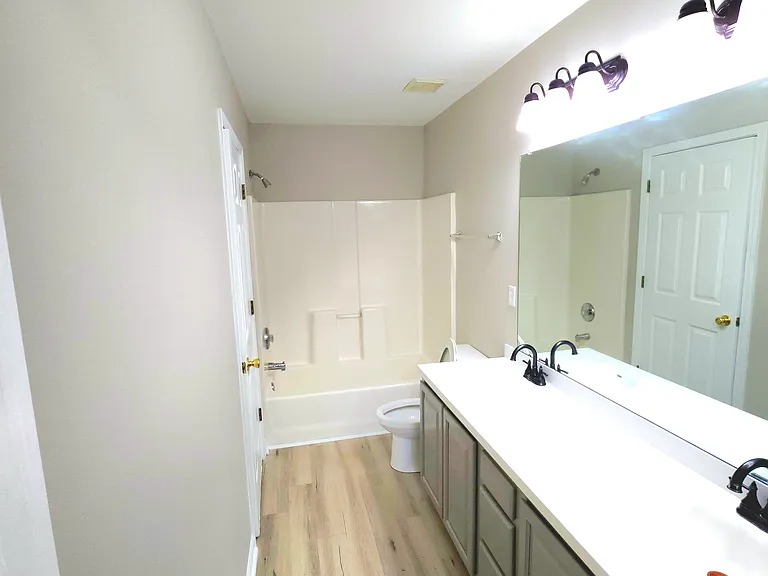 Master bathroom with attached laundry room