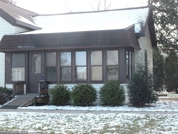 Enter over an enclosed porch..