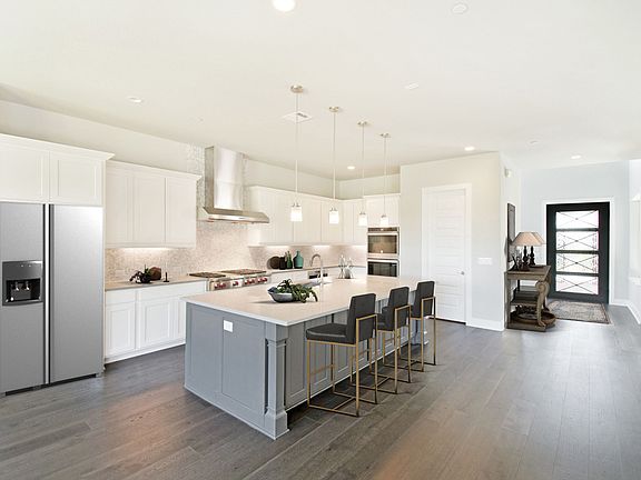 Kitchen with center island is open to the great room, virtually staged for demonstration