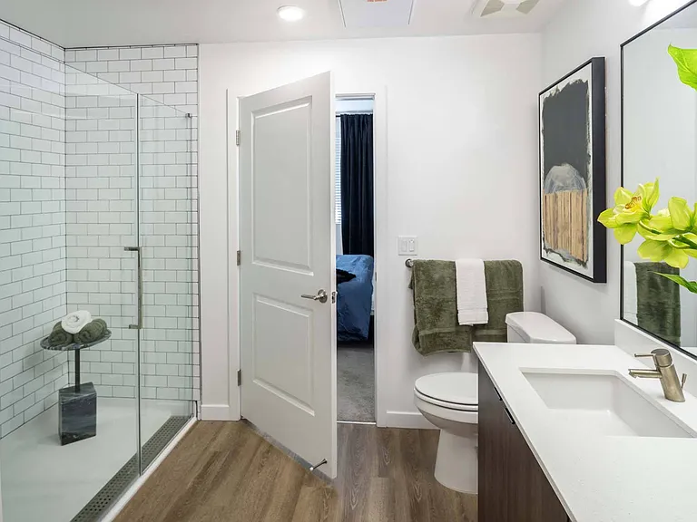 Experience luxury in a modern bathroom, featuring sleek finishes and a refreshing, contemporary design.