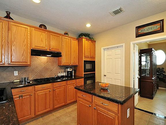 There is a lot of counter and "leaning" space for our friends. Behind this door is pretty large utility room. We also have an Osmosis Water System.