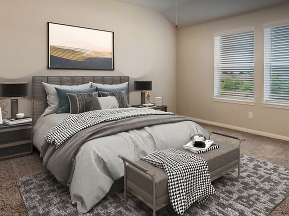 Enjoy a private primary suite tucked away in the back of the home.