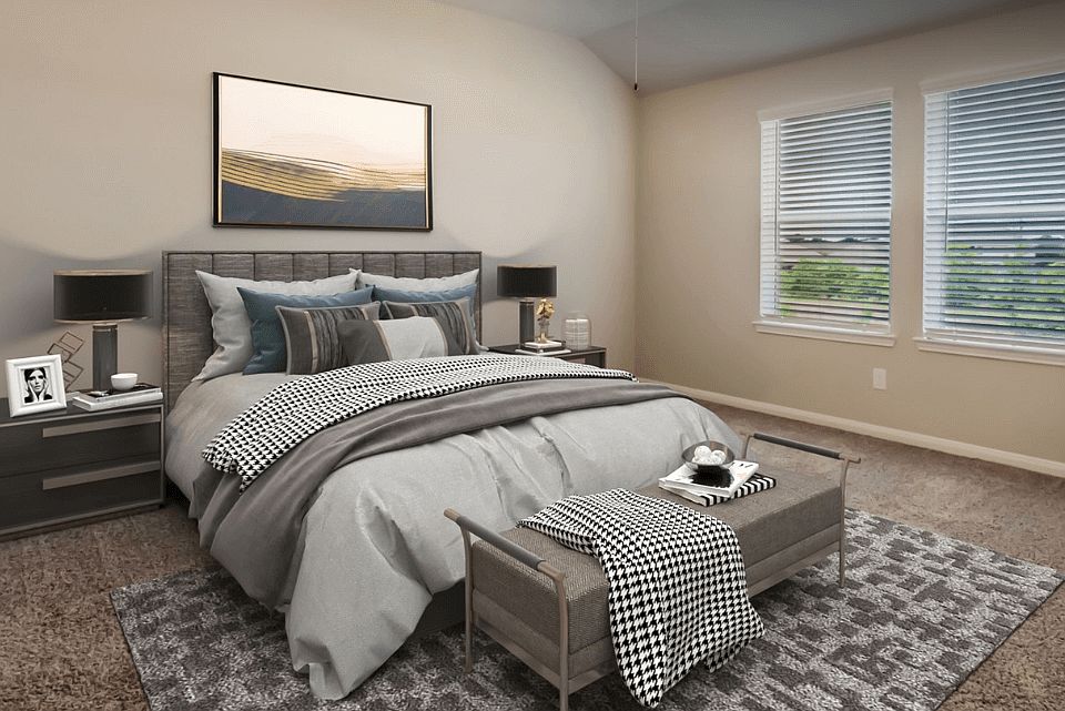 Enjoy a private primary suite tucked away in the back of the home.