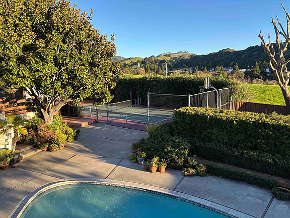 Backyard view from the deck. Pool, Pickleball Court, Basketball, Dirt Play Area, Common Area, View of Saint Marys College