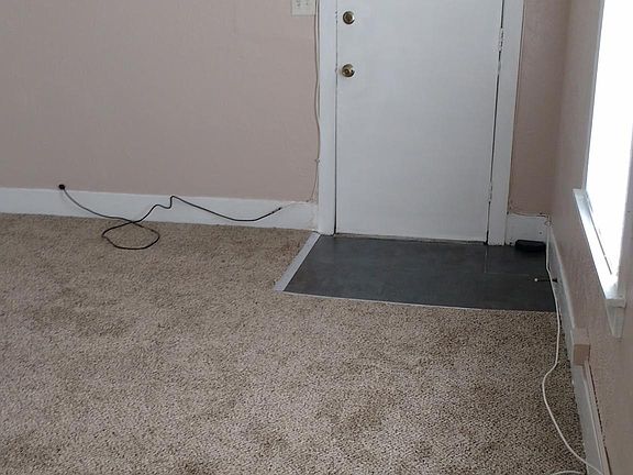 Front entrance to living room. New carpet, paint, blind