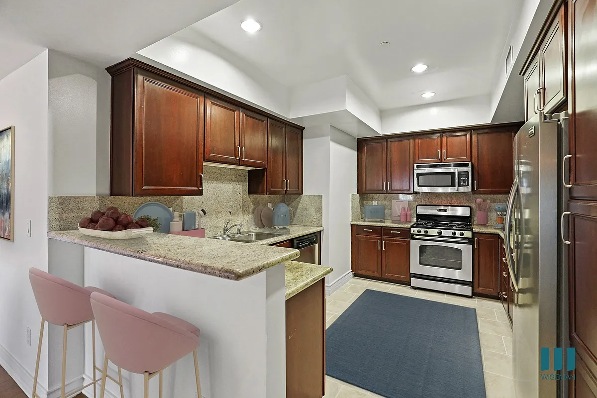 Full-Size Kitchen with Stainless-Steel Refrigerator, Stove, Microwave Oven, and Dishwasher - McClellan Corner