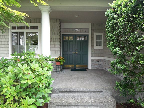 The large covered porch is a great place to enjoy a little shade in the summer
