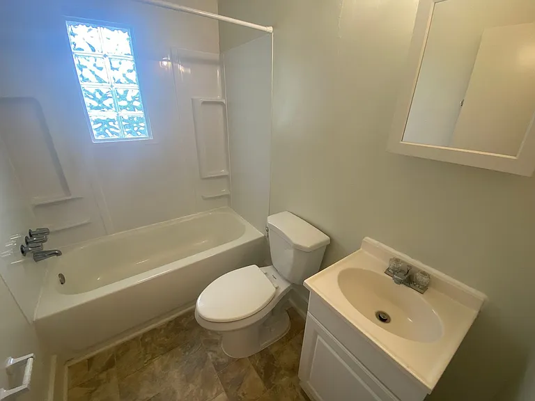 Private carport, in-unit laundry, and the Lakewood strip right outside your door. — Photo 9