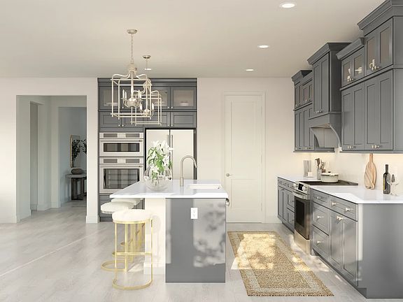 Kitchen with glass upper cabinets and pendant lighting