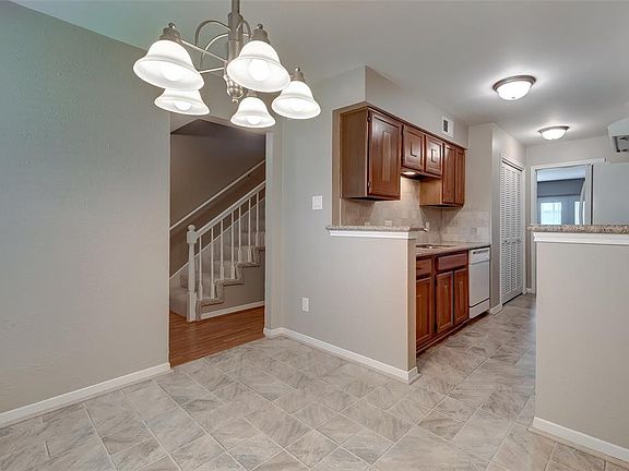 Dining room is open to the kitchen and hallway.