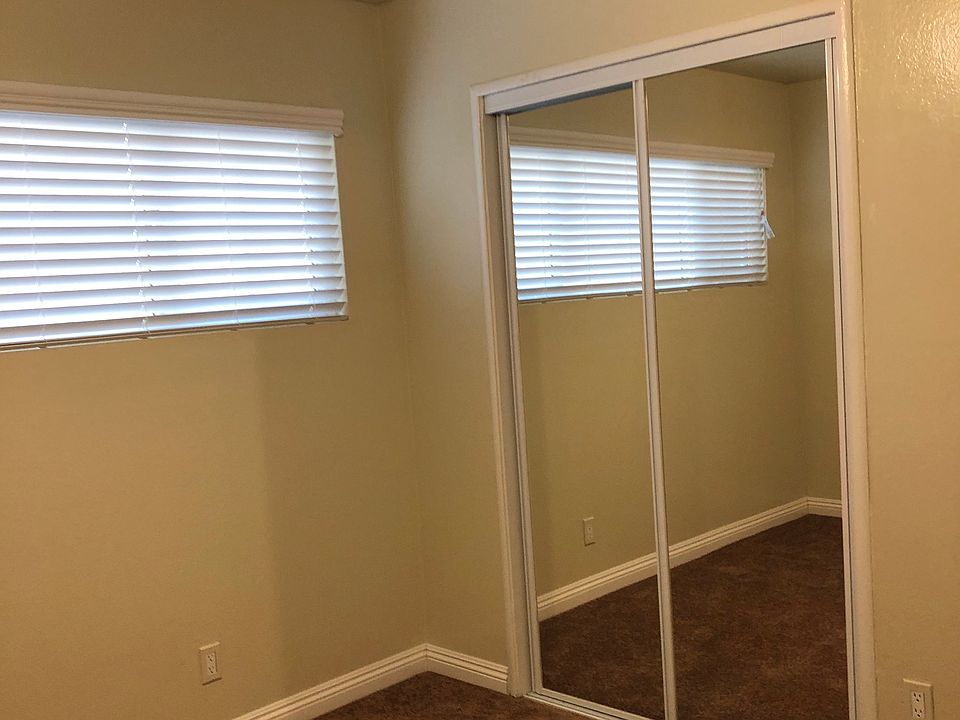 double door mirrored wardrobes, new carpet, new Venetian blinds and ceiling fans in all bedrooms