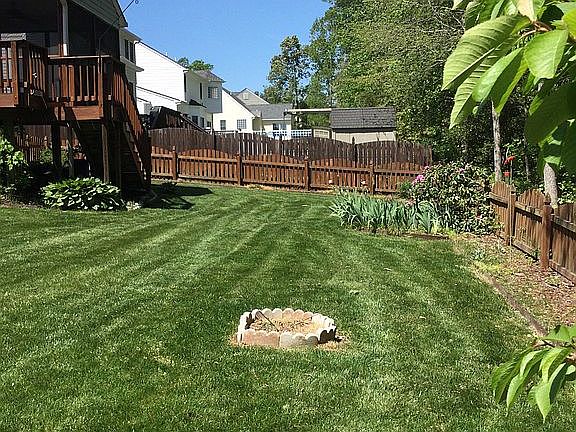 Large back yard facing woods