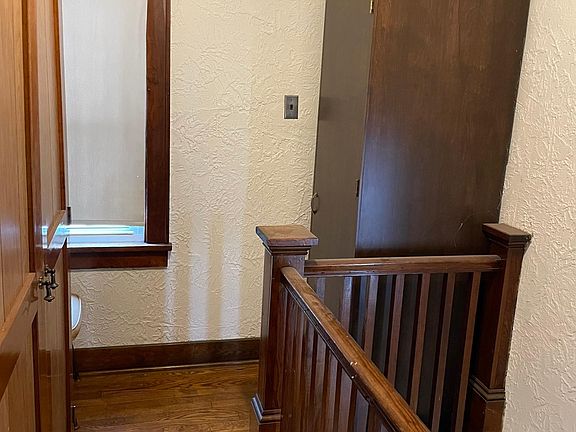 Upstairs landing with two self standing closets.