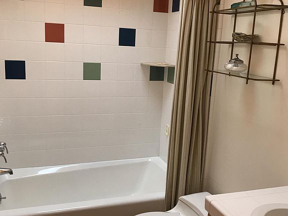 Bath and shower in guest bathroom #1.