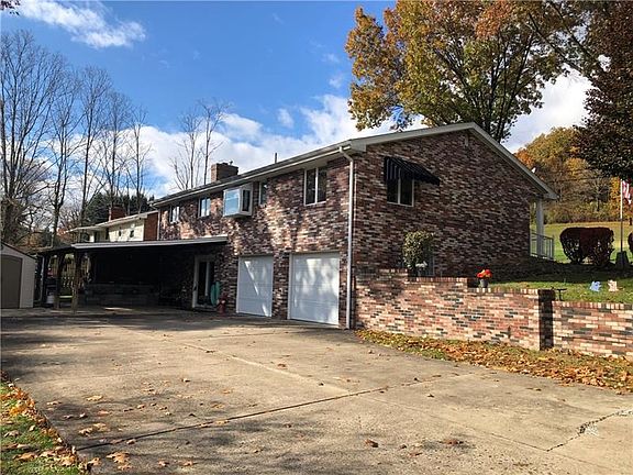 Large concrete drive way and covered patio for all of your entertaining!