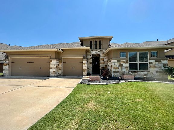 3 Car garage with extra storage, high ceiling entrance