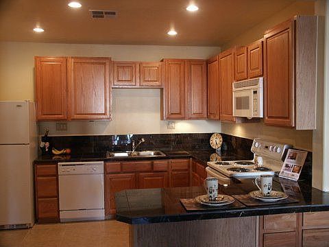 Kitchen w/granite counter tops and backsplash, all appliences included