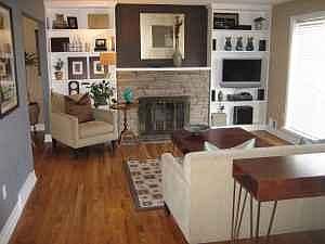 Large living space with hardwood floors, and wood burning fireplace