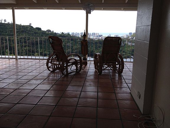 Part of living area with all Mexican tile floors and sliding
