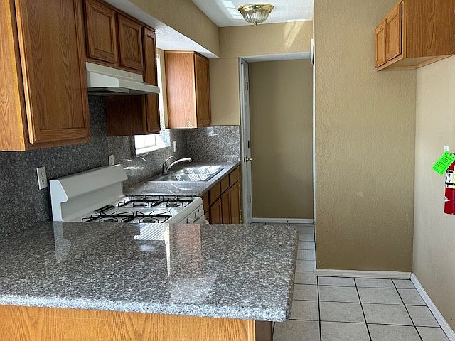 Kitchen granite counter tops small pantry and washer & dryer hook ups, at the end of the kitchen.
