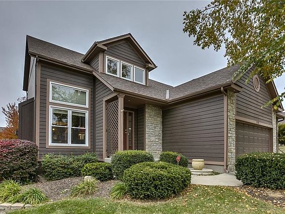 This  1 1/2 story home has fantastic curb appeal