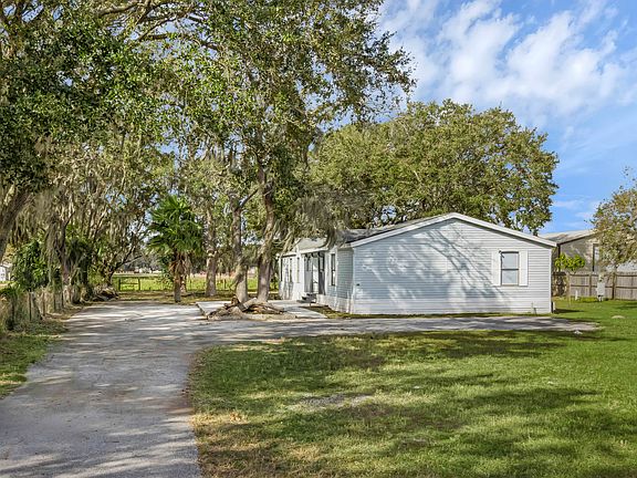 Oversize driveway leading to the front of the home.