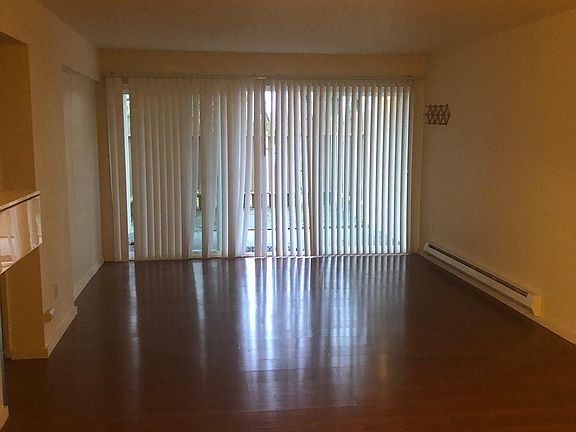 Spacious living room with new wood vinyl flooring