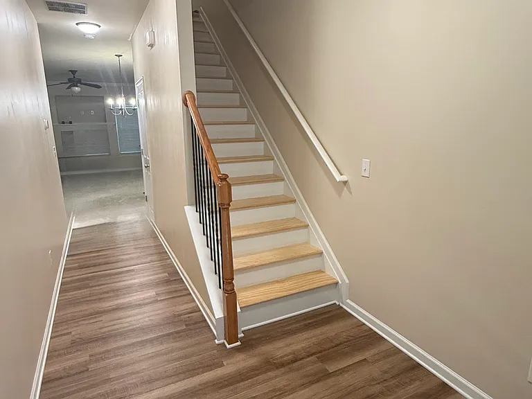 Entryway with newly installed hardwood steps