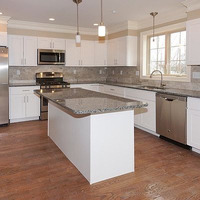 Kitchen With Stainless Steel Appliances and Granite Countert