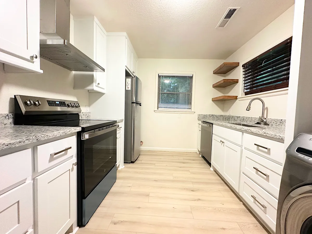 Brand new custom kitchen cabinets, granite counter tops, appliances, fixtures, and new flooring throughout. - 515 N Fallin Ave #515