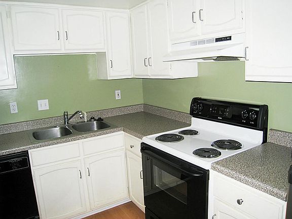 Comes with stove, dishwasher, refrigerator, washer & dryer. Garbage disposal replaced 2013.