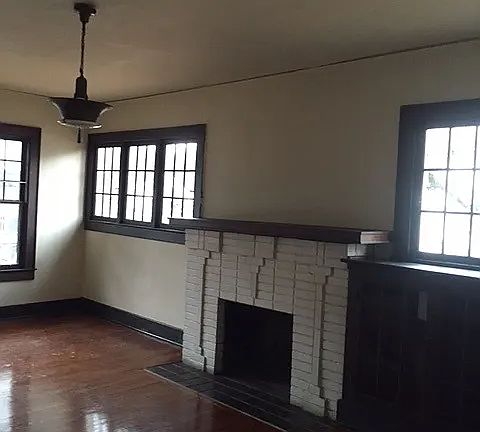 Large living room with many windows for light. Room size approx 15X22