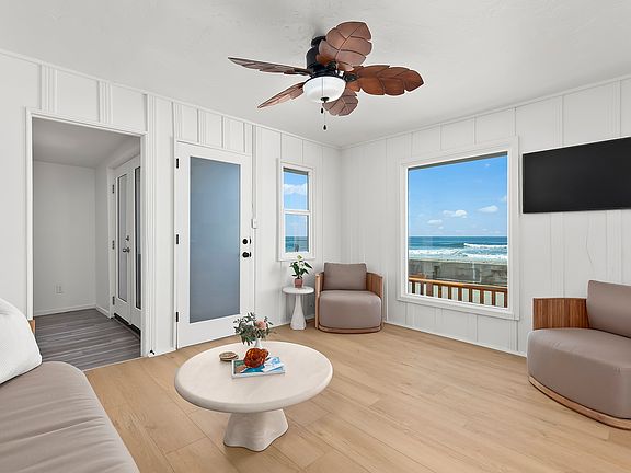Breathtaking ocean views from the living room. Relax in a bright, airy space with natural light and an uninterrupted view of the waves.