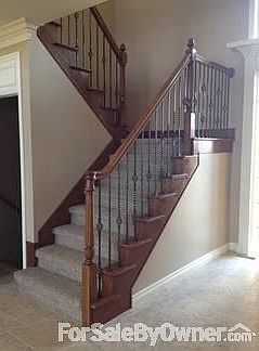 Staircase
						:
						Solid wood railing with iron spindles