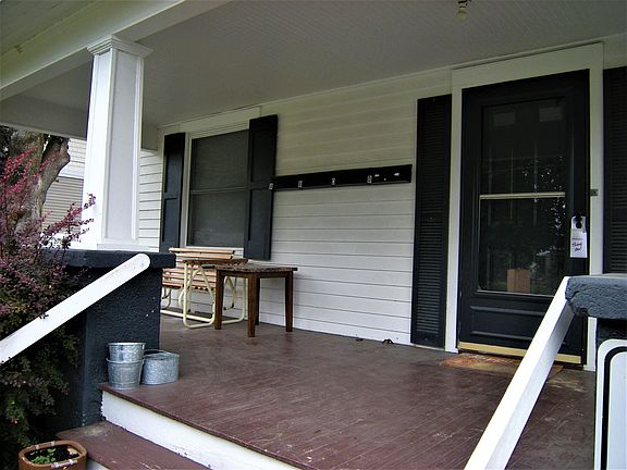 Covered front porch. This the door to access the upstairs apartment.