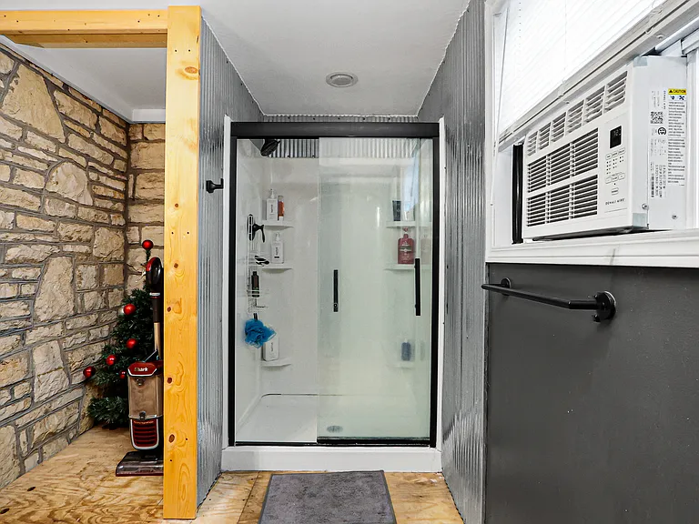 First floor bath with storage nook and walk in shower