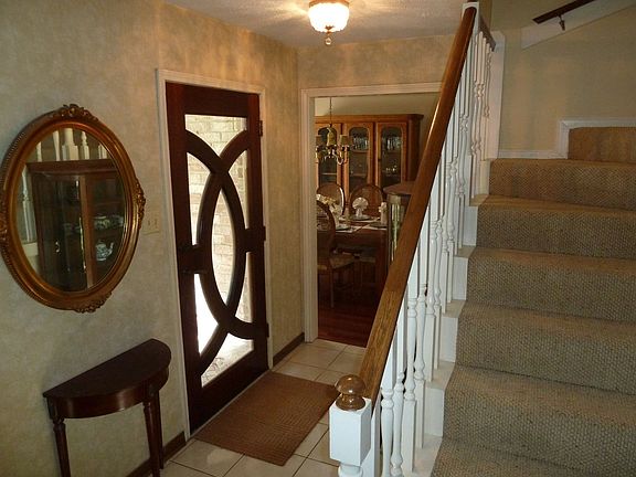 Entryway showing custom wood door