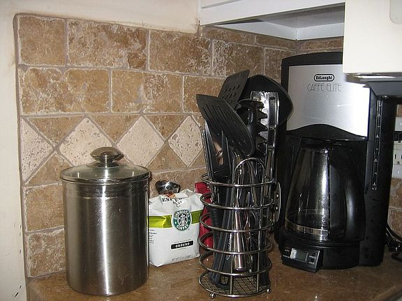 Travertine backsplash as well