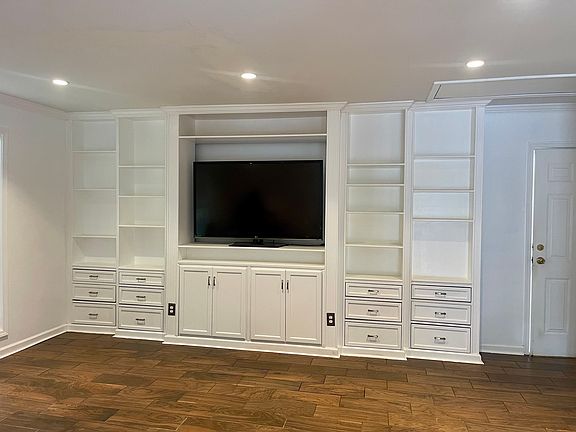 Family room with custom built-in wall unit.