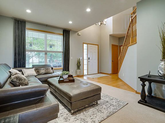 Living room with 2-story foyer