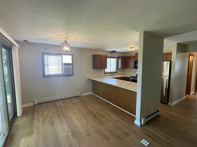 dining area open to kitchen bar and large open living room
