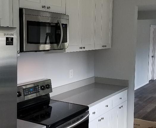 Fridge, stove and microwave.