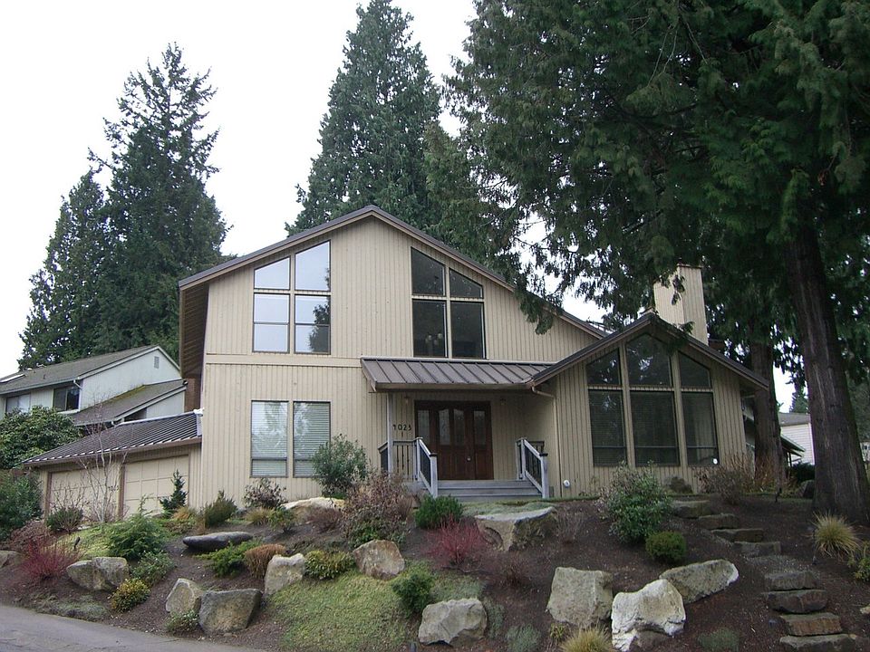 Front view - professionally landscaped corner lot